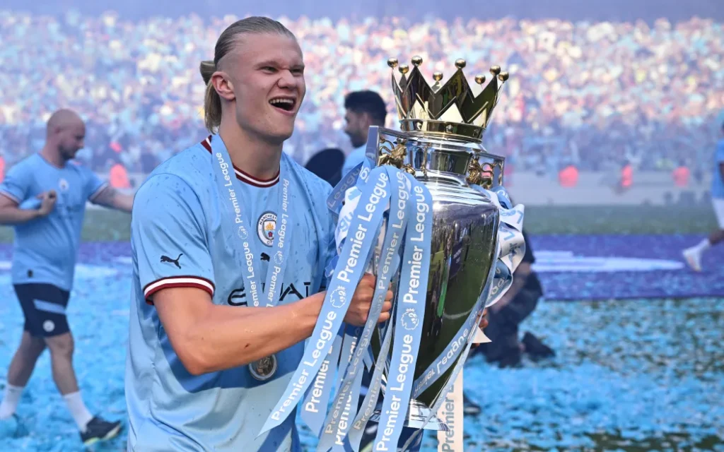 Erling Haaland holds the Premier league Trophy 2024