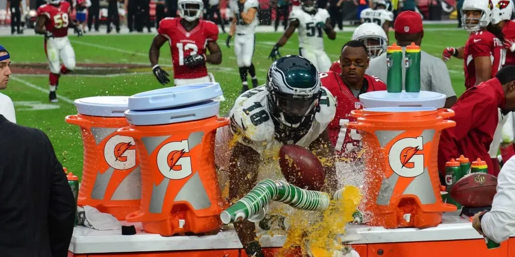 NFL Player Dives in to Gatorade table